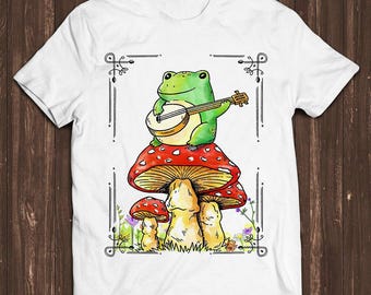 Maglietta unisex con meme "Toad Frog Playing Banjo On Magic Mushroom" per giocatori retrò, appassionati di musica e film cult, un regalo fantastico (C1023)