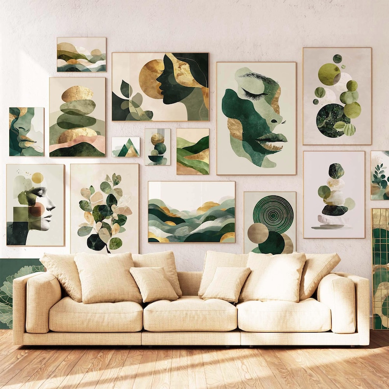 May include: A collection of framed wall art featuring abstract designs in shades of green, gold, and beige. The artwork includes depictions of faces, landscapes, and geometric shapes. The art is displayed above a beige sofa with several pillows.