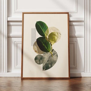 May include: A framed art print featuring a botanical collage. The artwork includes green leaves, overlapping circular shapes in neutral tones, and a vertical line of black stripes. The frame is made of wood.