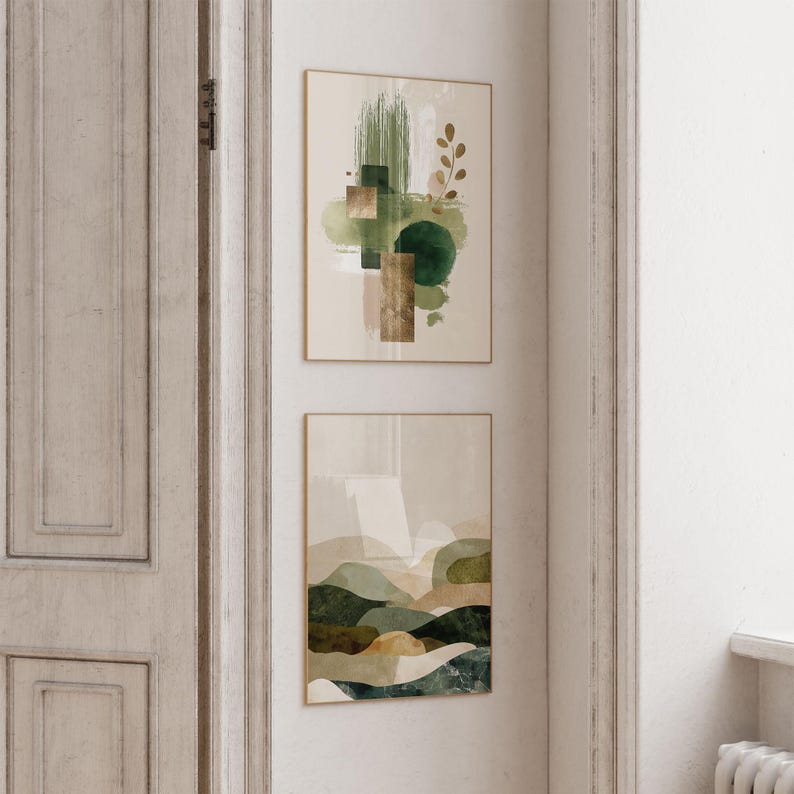 May include: Two framed abstract art prints. The top print features green brushstrokes, geometric shapes, and a sprig of leaves. The bottom print depicts a landscape with rolling hills in shades of green, brown, and beige. Both prints have gold frames.