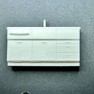 3D resin printed O scale 1:48 1940s kitchen sink cabinet; white resin. Can be made in S scale too; email me for price quote