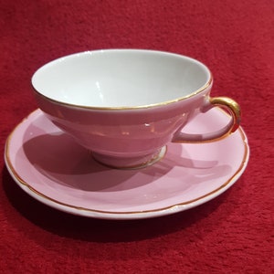 Pink ceramic tea cup with gold edge
