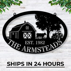 May include: Black metal oval sign with a silhouette of a red barn, a tree, a cow, and a tractor. The sign reads "The Armsteads Est. 1982".