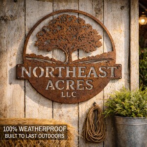 May include: A rustic, circular metal sign with the text "NORTHEAST ACRES LLC" and a tree design. The sign is mounted on a weathered wooden surface. A rope and a metal bucket with greenery are visible.