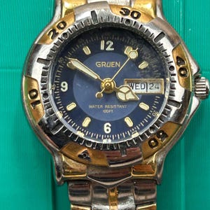Gruen GR213 Two Tone Blue Dial Day‎ Date Rotating Bezel Quartz Watch Gruen Bezel Watch - Etsy main image 2
