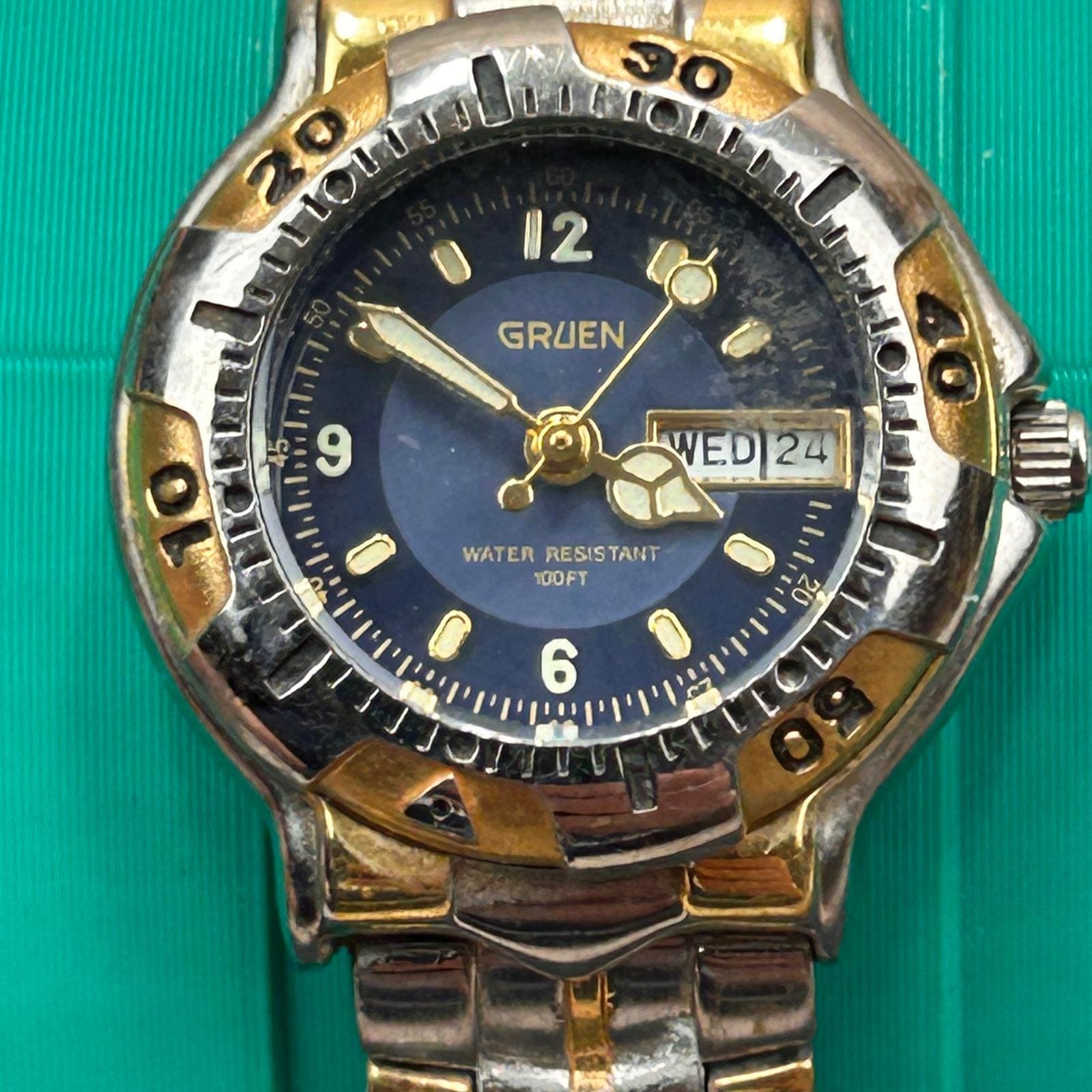 Gruen GR213 Two Tone Blue Dial Day Date Rotating Bezel Quartz