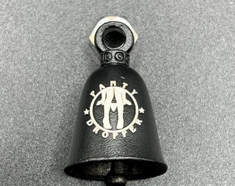 May include: Black motorcycle bell with a silver top and a small clapper. The bell features the text "Naughty Dropper" in a white, circular design. The bell is made of metal and has a matte finish.