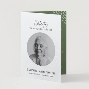 May include: A folded memorial card featuring a black and white portrait of a woman in a circular frame. The text reads "Celebrating the Beautiful Life of SOPHIE ANN SMITH" with dates below. The card has a green patterned back.
