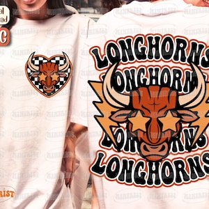 May include: Two white t-shirts with a graphic design of a brown bull with black horns and the text "Longhorns" in black and orange. The bull has star-shaped eyes.