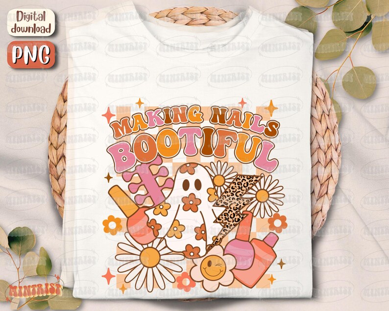 May include: White t-shirt with a retro design featuring the text "MAKING NAILS BOOTIFUL". The design includes a ghost, nail polish bottles, daisies, and a leopard print lightning bolt in shades of orange, pink, and brown.