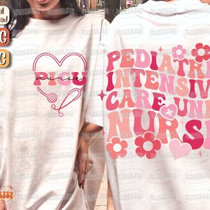 May include: Two white t-shirts with pink and red text and graphics. The front shirt says "PICU Nurse" in a heart shape with a stethoscope. The back shirt says "Pediatric Intensive Care Unit Nurse" in a retro font with pink and red flowers and hearts.