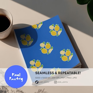 May include: A blue notebook featuring a repeating pattern of yellow lemons and lemon slices. The notebook has the text "SEAMLESS & REPEATABLE!" and "Pixel Pantry". The notebook is on a light-coloured surface.