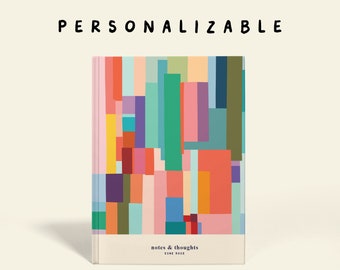 May include: A colorful notebook with a geometric pattern on the cover. The cover is made of a textured material and has a white band at the bottom with the text "notes & thoughts" and "ESME ROSE".
