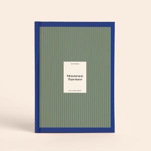 May include: A hardcover notebook with a blue spine and border, featuring a vertical striped pattern in sage green and dark gray. A central white rectangular label displays the text "NOTEBOOK", "Monroe Turner", and "200 LINED PAGES".