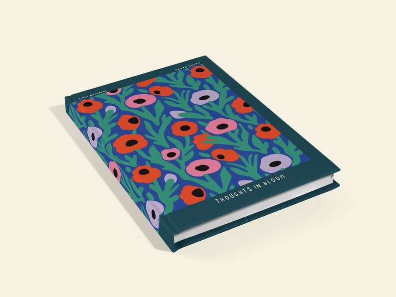 May include: A hardback journal with a floral pattern. The cover displays a blue backdrop with red, pink, and purple flowers and green leaves. The words "THOUGHTS IN BLOOM" are printed on the cover.