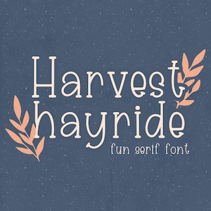 May include: A graphic design for a font called "Harvest Hayride" with a fun serif font style. The design features the text in white against a blue background with two stylized orange leaves on either side of the text.