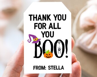 May include: White gift tag with black text that says "Thank you for all you BOO!" with a witch's hat, pumpkin, and spider illustration. The tag also says "From: Stella".
