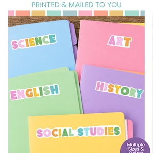 May include: Custom school subject labels featuring colorful, multi-toned text on white backgrounds. The labels read Science, Art, English, History, and Social Studies, applied to various pastel-colored folders in light blue, pink, green, purple, and yellow.