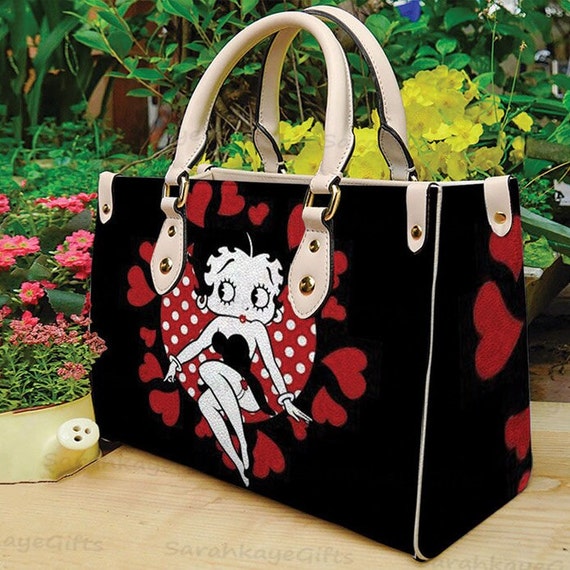 A Wink and A Kiss Women's Betty Boop Convertible Handbag Featuring An All-Over Red Kiss Print Pattern - Christmas Gift