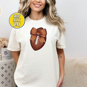 Coquette Football With Bow T-Shirt, Football T Shirt, Football Bow Gift, Football Season tshirt, Football Mom T-shirt, Football Lover -S023