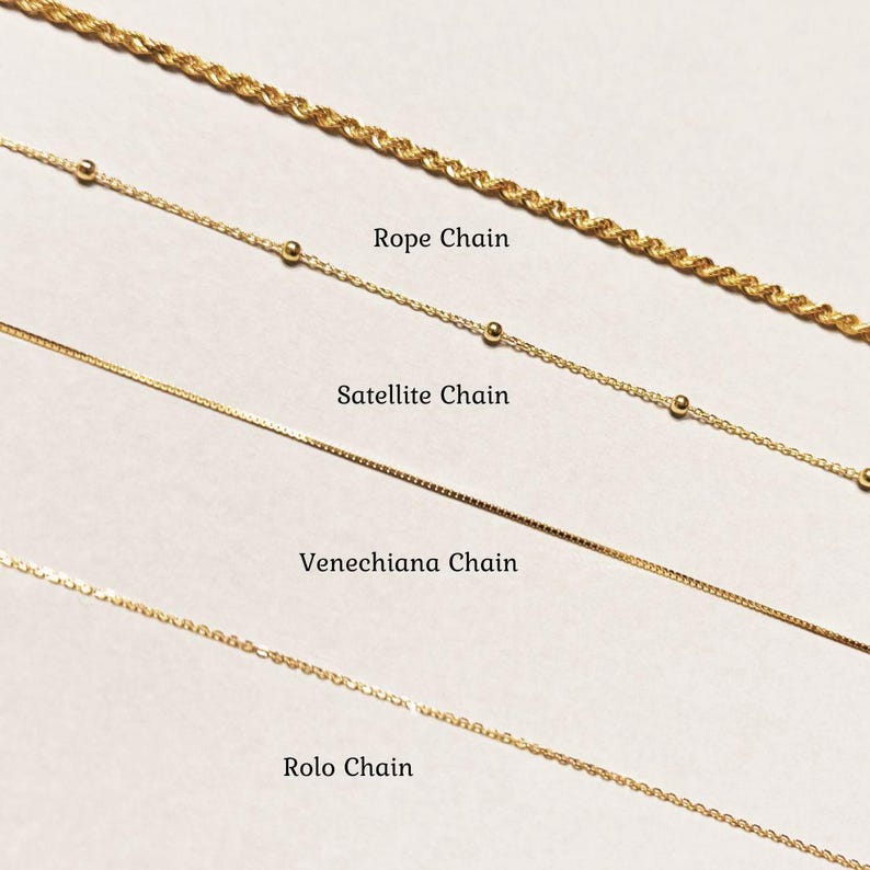 a bunch of different types of chains on a table