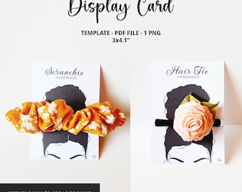 May include: Two display cards for hair accessories. The card on the left features a scrunchie with an orange and white pattern. The card on the right features a hair tie with a peach-colored flower. Both cards have a silhouette of a woman with a bun and the text "HANDMADE".