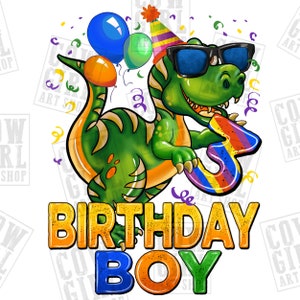 May include: A green dinosaur wearing sunglasses and a party hat holds a rainbow number three. The dinosaur is surrounded by confetti and balloons. The text "Birthday Boy" is written below the dinosaur in colorful letters.