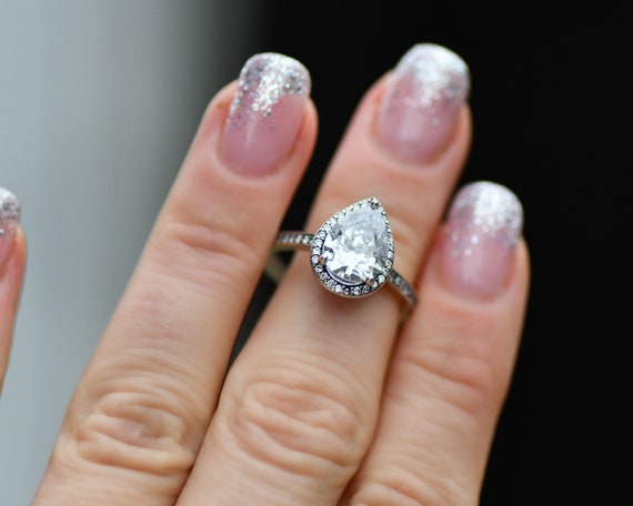 Sparkling teardrop halo ring clearance