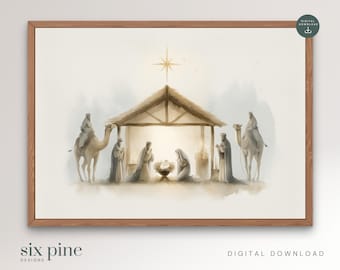 Puede incluir: Impresión en acuarela de la escena de la Natividad, con la Sagrada Familia, los Reyes Magos y camellos. La escena está ambientada en un establo con una estrella encima. La impresión está enmarcada en un marco de madera. El texto "six pine designs" y "digital download" está en la parte inferior.