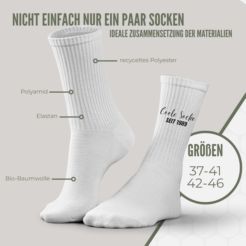 May include: White crew socks with ribbed texture. The text "Coole Socke SEIT 1989" is printed on one sock. The image also shows the sizes 37-41 and 42-46. The socks are made of recycled polyester, polyamide, elastane, and bio-cotton.