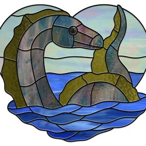 May include: A stained glass depiction of a sea serpent in a heart-shaped frame. The serpent is green and blue with a swirling pattern. The background is a light blue with a white sky.
