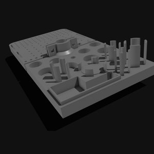 May include: A grey 3D model of a rectangular base with various cylindrical and rectangular protrusions. The base has a series of holes and a circular indentation. The model is set against a black background.