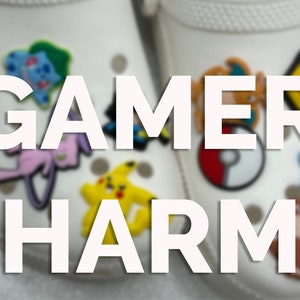 May include: White clogs with colorful cartoon character shoe charms. The charms are of various Pokemon characters. The text "GAMER CHARMS" is printed in white on the clogs.