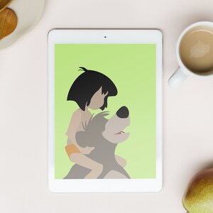 Puede incluir: Una tableta blanca con una pantalla verde que muestra una imagen de dibujos animados de un ni&ntilde;o montando un oso. El ni&ntilde;o lleva un taparrabos marr&oacute;n y tiene el pelo negro. El oso es marr&oacute;n y tiene un hocico blanco.