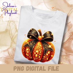 May include: White t-shirt featuring a detailed, sparkling pumpkin design with a black bow and gold accents. The pumpkin is orange with gold glitter details. The text "PNG DIGITAL FILE" is at the bottom of the shirt.