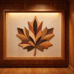 May include: A wall-mounted wooden maple leaf art piece composed of various wood tones including light tan, medium brown, and dark espresso. The leaf is centered within a rectangular wooden frame featuring integrated warm lighting.
