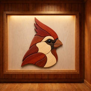 May include: A wall-mounted wooden marquetry art piece depicting the profile of a cardinal bird. The design is composed of various wood grains and tones, including deep reddish-brown, light tan, and dark brown segments, creating a layered effect.