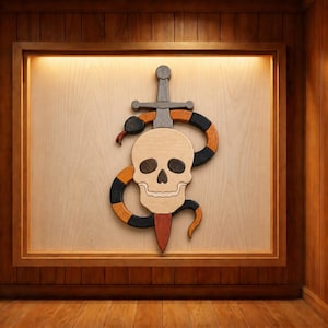 May include: Wooden wall art featuring a skull pierced by a sword, with a snake coiled around it. The skull is light brown, the snake is black and orange, and the sword is gray. The artwork is framed in a wooden shadow box.