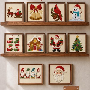May include: Ten framed Kinusaiga art pieces displayed on wooden shelves. The images feature Christmas themes including Santa, reindeer, bells, a cardinal, snowman, stockings, gingerbread house, tree, gnomes, and Santa face. Text reads: Beginner Christmas Kinusaiga Patterns! and 10 Printable Christmas Bundle.