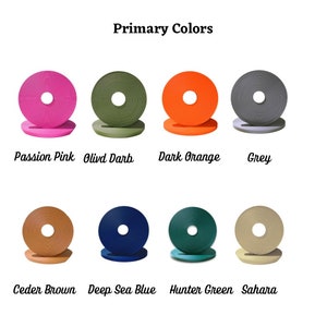 May include: A chart showing 10 different colors of ribbon, with the name of each color written below it. The colors are: Passion Pink, Olivd Darb, Dark Orange, Grey, Ceder Brown, Deep Sea Blue, Hunter Green, Sahara.