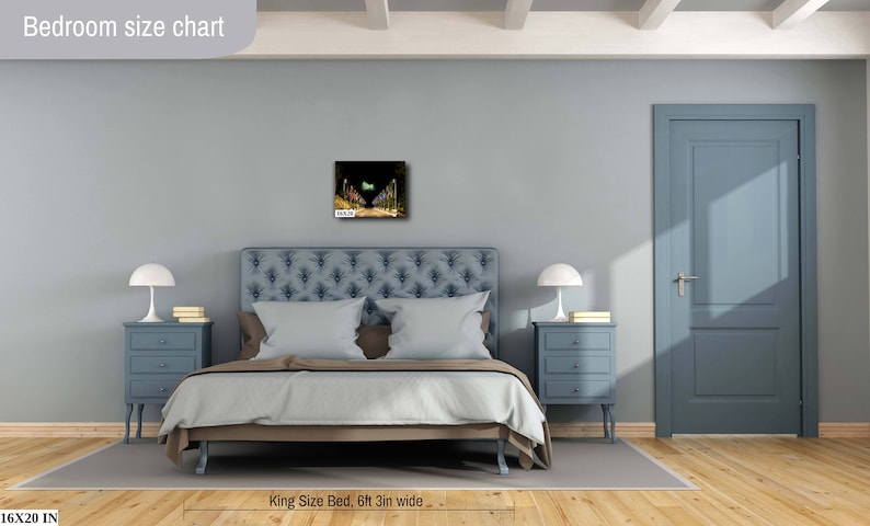 May include: A bedroom with a king-size bed, two nightstands with lamps, and a framed picture on the wall. The bed is made with white bedding and has a blue headboard. The nightstands are blue and have three drawers each. The picture is a landscape scene with a green and yellow color scheme. The room is painted a light blue color. The text "Bedroom size chart" is at the top of the image. The text "King Size Bed, 6ft 3in wide" is at the bottom of the image. The text "16x20 IN" is in the bottom left corner of the image.