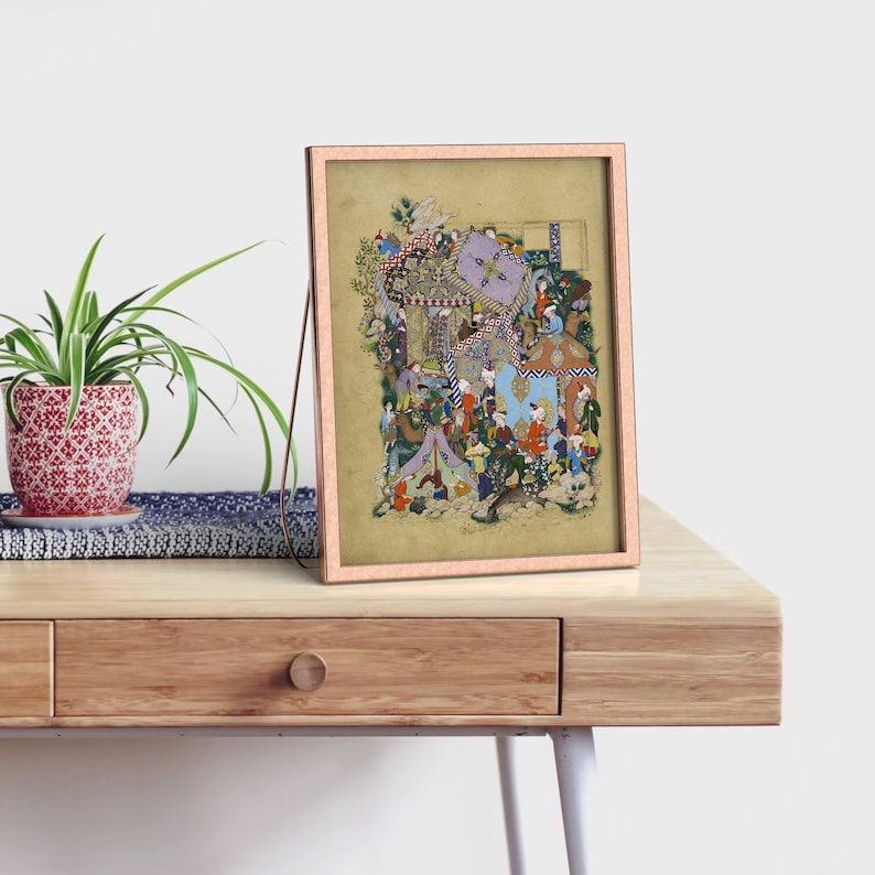 May include: A framed artwork depicting a colorful and intricate Persian miniature painting. The painting features a scene with many figures and details, including a tent, a tree, and a variety of animals. The artwork is framed in a light brown frame.