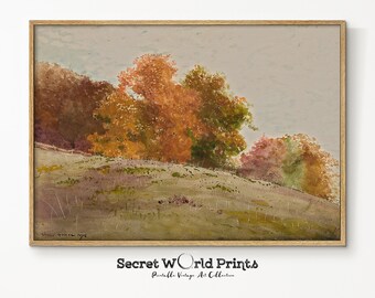 May include: A watercolour painting of a landscape with a hill covered in green grass and trees with orange, red, and brown leaves. The sky is a light grey colour.