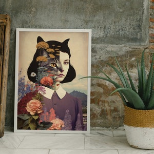 May include: A framed print of a woman with a cat's face, surrounded by flowers and foliage. The woman has dark hair and is wearing a purple dress with a white collar. The background is a landscape with mountains and a field.