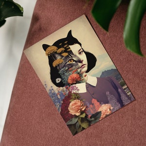 May include: A surreal collage featuring a woman with a cat's face, surrounded by colorful flowers and greenery. The woman's hair is black and her eyes are closed. The cat's face is partially obscured by the flowers.