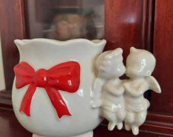 Porcelain kissing cherub cup