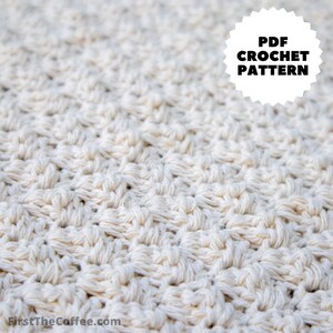 May include: Close-up of a crocheted fabric with a white, textured pattern. The fabric is made with a single strand of yarn and has a repeating stitch pattern. The image includes the text "PDF CROCHET PATTERN".