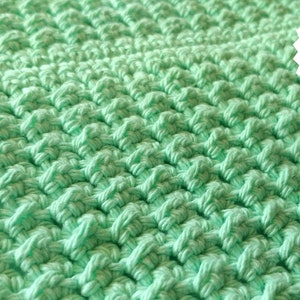 May include: A close-up of a green crocheted fabric with a white label that says "PDF CROCHET PATTERN".