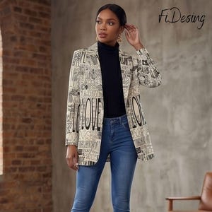 May include: A beige blazer featuring a black newspaper-style print with the word LOVE in large letters, worn over a black turtleneck sweater and blue denim jeans. The blazer has long sleeves and a structured collar. The text FiDesing is visible.