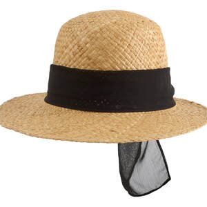 May include: A straw hat with a wide brim and a black ribbon around the crown. The ribbon has a long tail that hangs down the back of the hat.